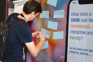 Participant joining the interactive discussion about the future of SWIB
