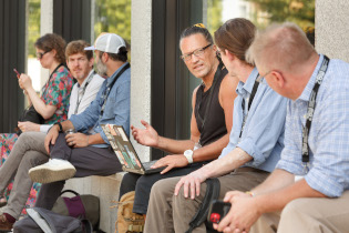 Participants in discussion during break, enjoying Berlin summer